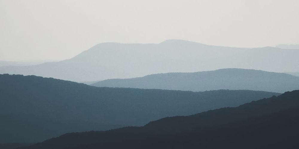 Ranges of hills receding into haze, each one paler than the last