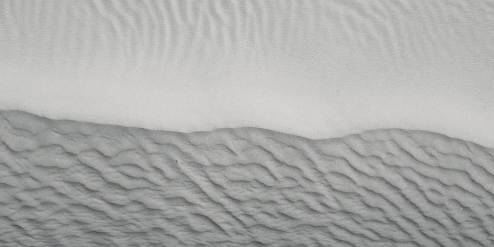 Wind ripples running across a dune, photographed from above