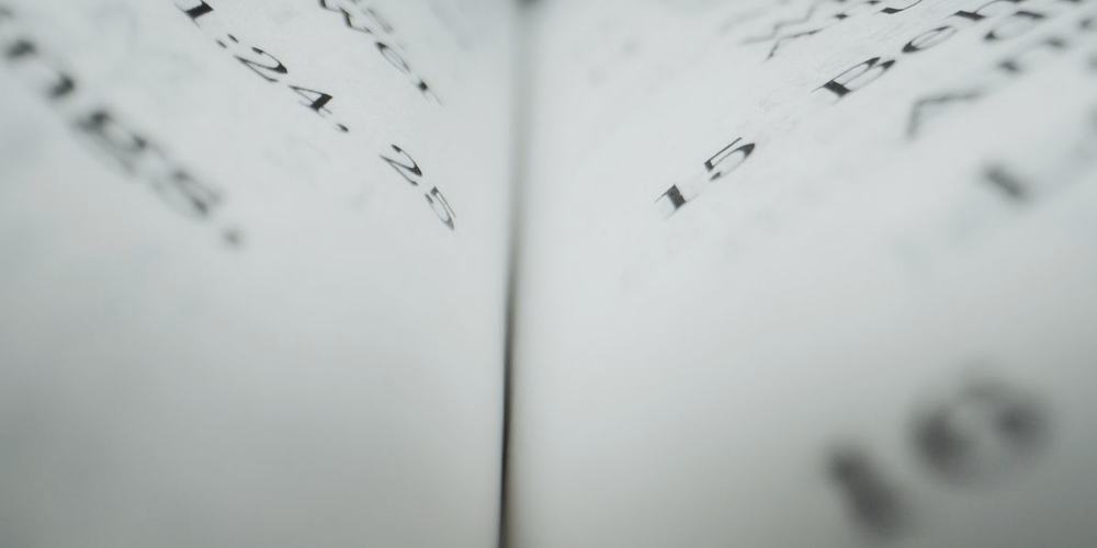A page of printed text seen close, the words falling out of focus